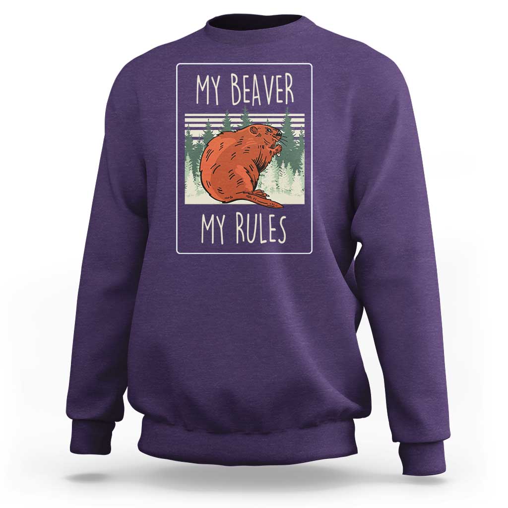 Purple sweatshirt with beaver graphic and 'My Beaver / My Rules' text on back.
