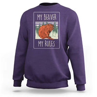 Purple sweatshirt with beaver graphic and 'My Beaver / My Rules' text on back.