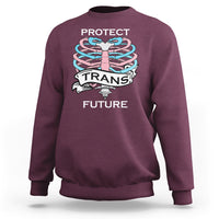 Maroon unisex sweatshirt with rib-knit cuffs and 'PROTECT TRANS FUTURE' front graphic