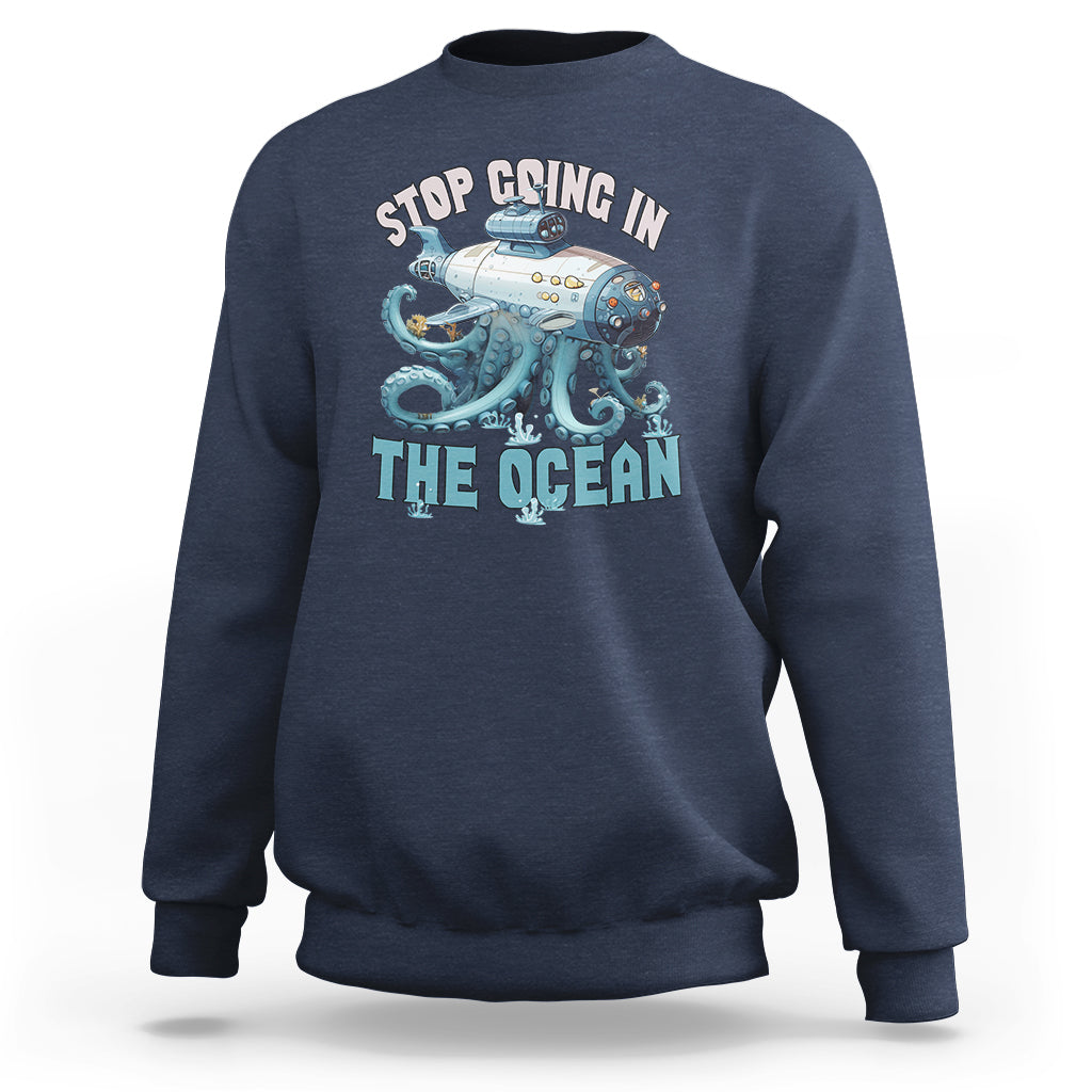 Navy crewneck sweatshirt with long sleeves and octopus-submarine front graphic print
