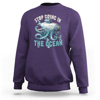 Purple crewneck sweatshirt with long sleeves and octopus-submarine front graphic print