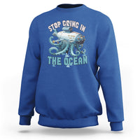 Royal blue crewneck sweatshirt with long sleeves and octopus-submarine front graphic print