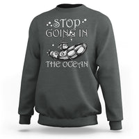 Dark heather crewneck sweatshirt with “Stop Going In The Ocean” submarine graphic on chest
