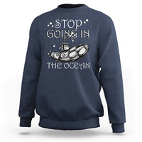 Navy crewneck sweatshirt with “Stop Going In The Ocean” submarine graphic on chest