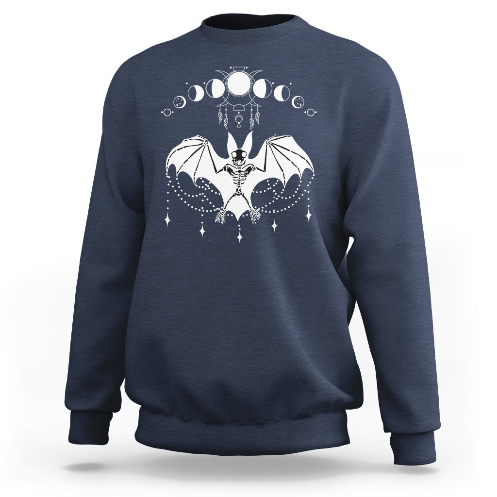 Navy crewneck sweatshirt with white bat witch graphic across the chest