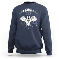 Navy crewneck sweatshirt with white bat witch graphic across the chest