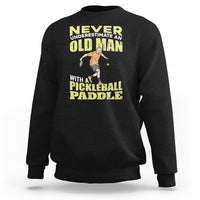 Black sweatshirt with crew neck and front pickleball paddler graphic