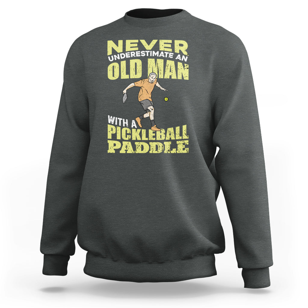 Dark heather gray sweatshirt with crew neck and front pickleball paddler graphic