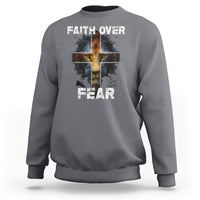 Charcoal crewneck sweatshirt with cross graphic and "FAITH OVER"/"FEAR" text