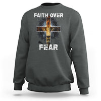Dark heather gray crewneck sweatshirt with cross graphic and "FAITH OVER"/"FEAR" text