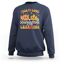 Navy crewneck sweatshirt with fall learning cartoon graphic on chest