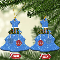 Blue ceramic Christmas tree-shaped ornaments with “NUTS” and hanging bauble icons; gold loops.
