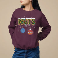 Maroon Christmas sweatshirt with 'NUTS' graphic and hanging ornament decor