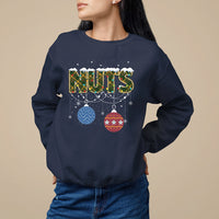 Navy Christmas sweatshirt with 'NUTS' graphic and hanging ornament decor