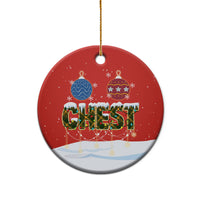 Red ceramic oval Christmas ornament with gold loop, “CHEST” nut design and snowy bottom