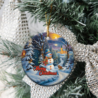 Blue ceramic round Christmas ornament with snowman, winter village, Merry Christmas text on display