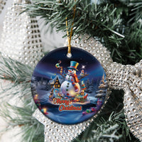 Blue ceramic snowman ornament with gold loop, circular shape, “Merry Christmas” text