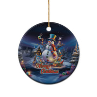 Blue ceramic snowman ornament with gold loop, circular shape, “Merry Christmas” text