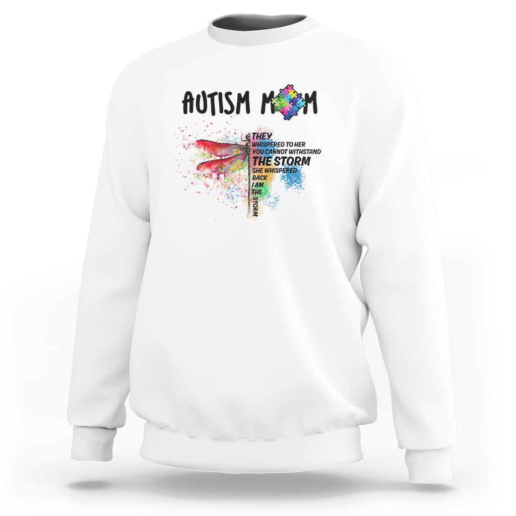 White sweatshirt with Autism rainbow puzzle storm graphic on front