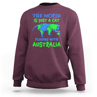Maroon crewneck sweatshirt with cat-and-Australia world graphic on front