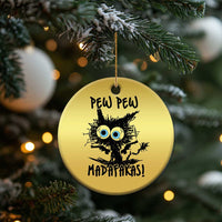 Gold round cat Christmas ornament hanging on a tree, 'PEW PEW MADAFakasi' text