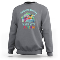 Charcoal crewneck sweatshirt with colorful turtle and autism acceptance graphic on chest