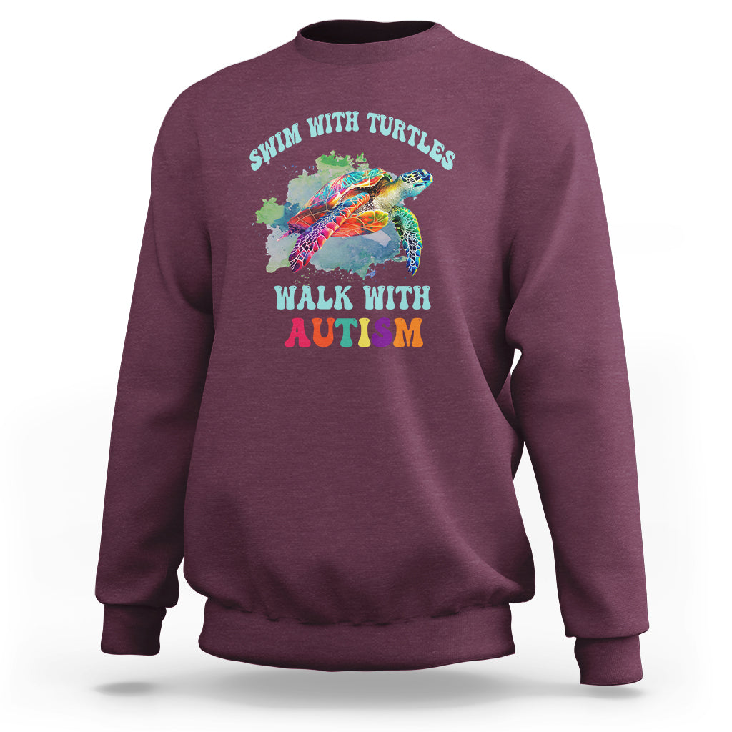Maroon crewneck sweatshirt with colorful turtle and autism acceptance graphic on chest