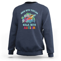 Navy crewneck sweatshirt with colorful turtle and autism acceptance graphic on chest