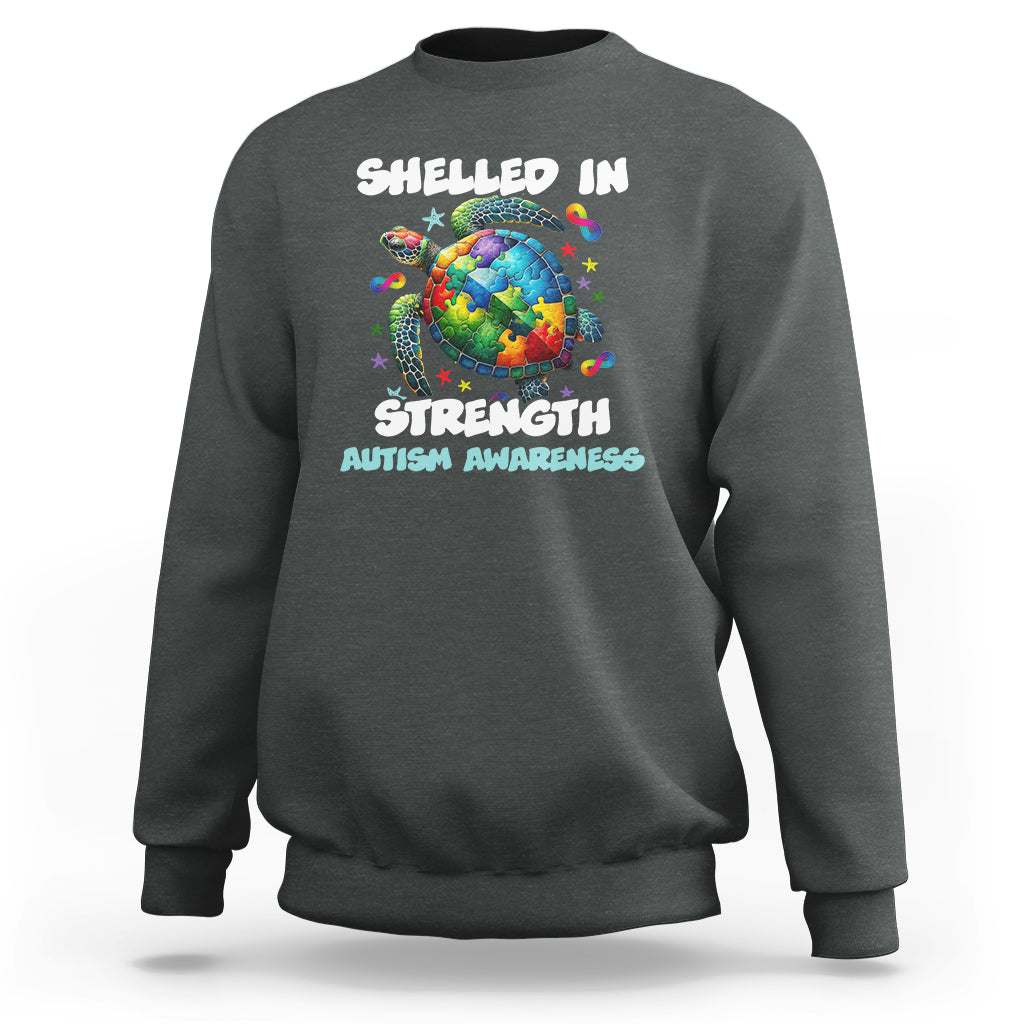 Charcoal gray autism awareness sweatshirt with turtle globe “Shelled In Strength” front print