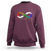 Autism acceptance sweatshirt in maroon, with rainbow infinity heart logo