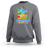Charcoal crewneck sweatshirt with colorful puzzle piece Autism Acceptance graphic on front