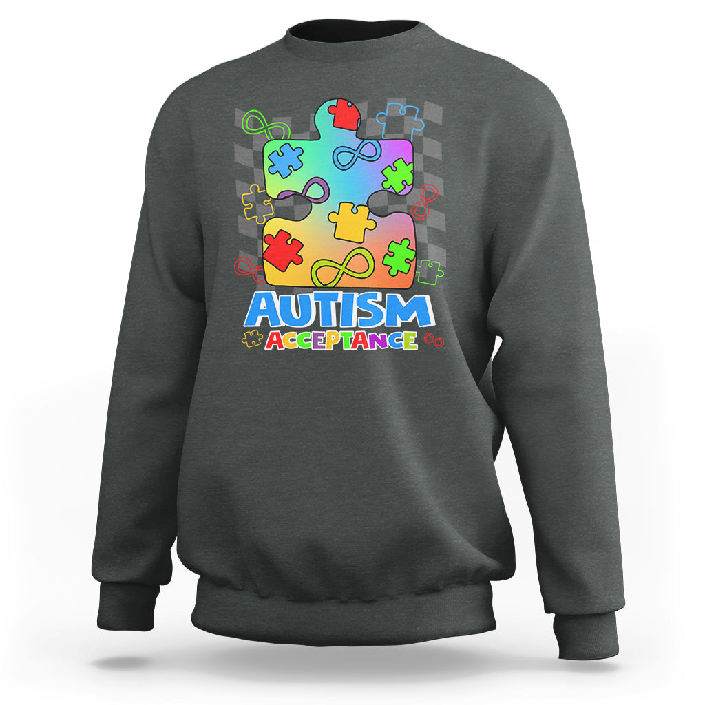 Dark heather crewneck sweatshirt with colorful puzzle piece Autism Acceptance graphic on front