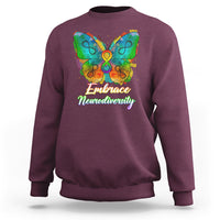 Maroon sweatshirt with rainbow butterfly graphic and “Embrace Neurodiversity” text