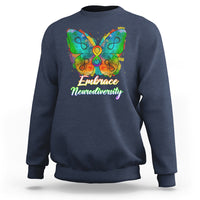 Blue sweatshirt with rainbow butterfly graphic and “Embrace Neurodiversity” text