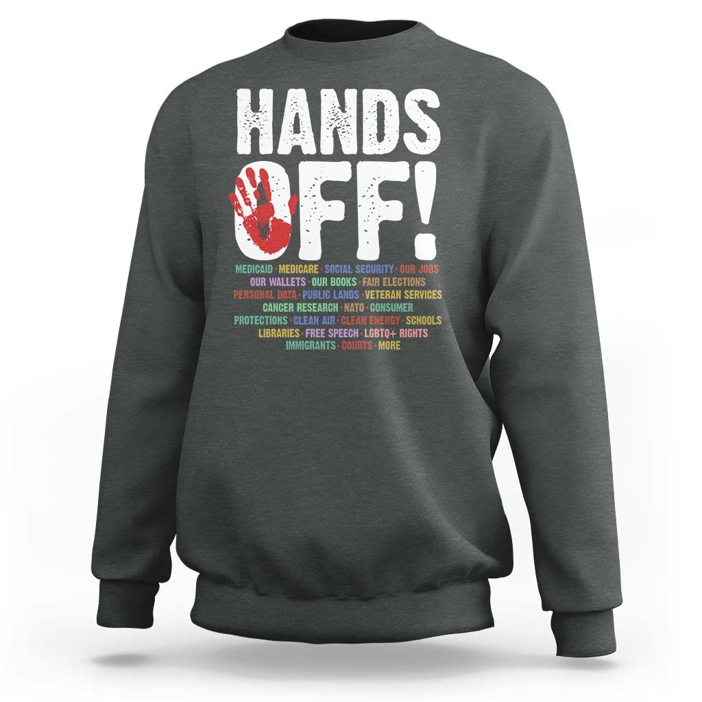 Charcoal crewneck sweatshirt with “HANDS OFF!” graphic on the back