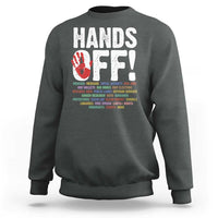 Charcoal crewneck sweatshirt with “HANDS OFF!” graphic on the back