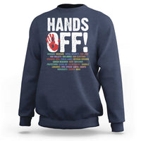 Navy crewneck sweatshirt with “HANDS OFF!” graphic on the back