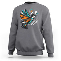 Dark gray kids sweatshirt with colorful bird and feather graphic on the front