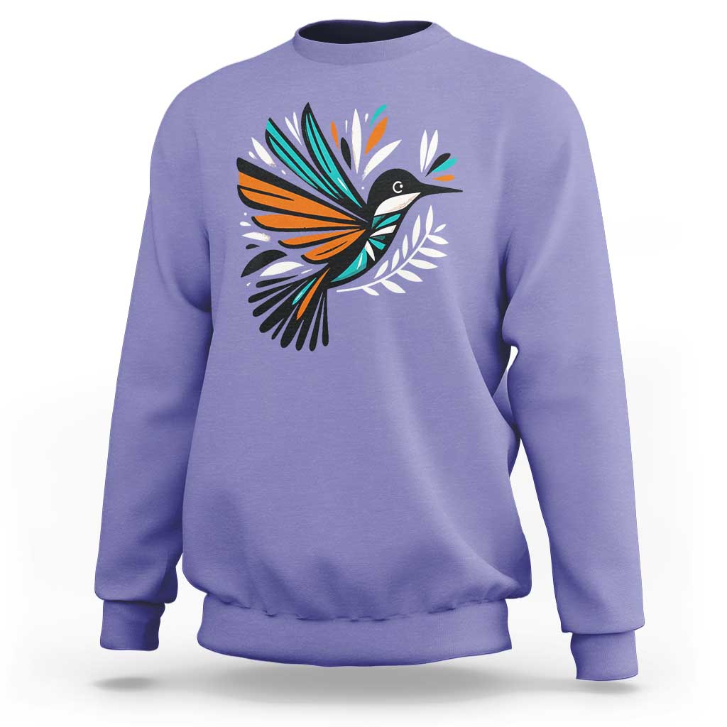 Lavender kids sweatshirt with colorful bird and feather graphic on the front