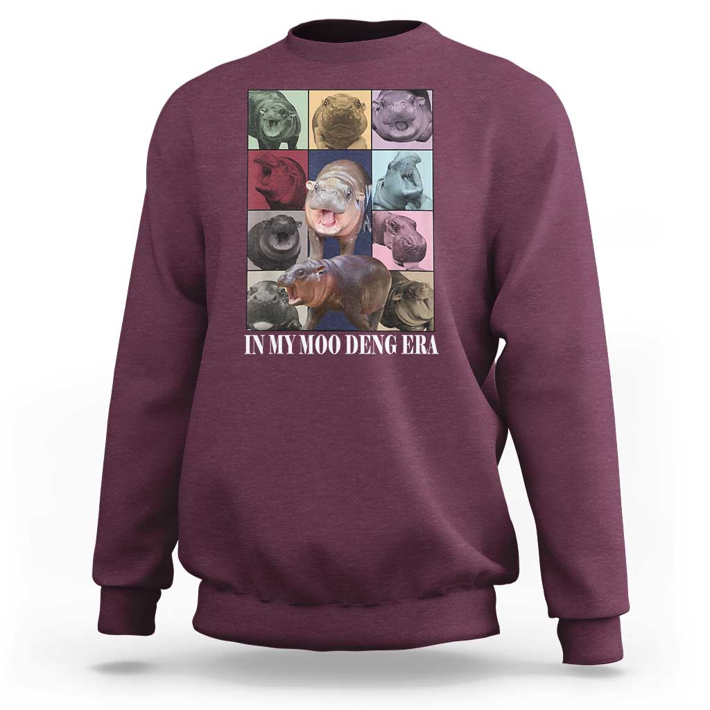 Maroon crewneck sweatshirt with colorful hippo graphic on front