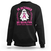 Black crewneck sweatshirt with pink breast cancer awareness graphic on back.
