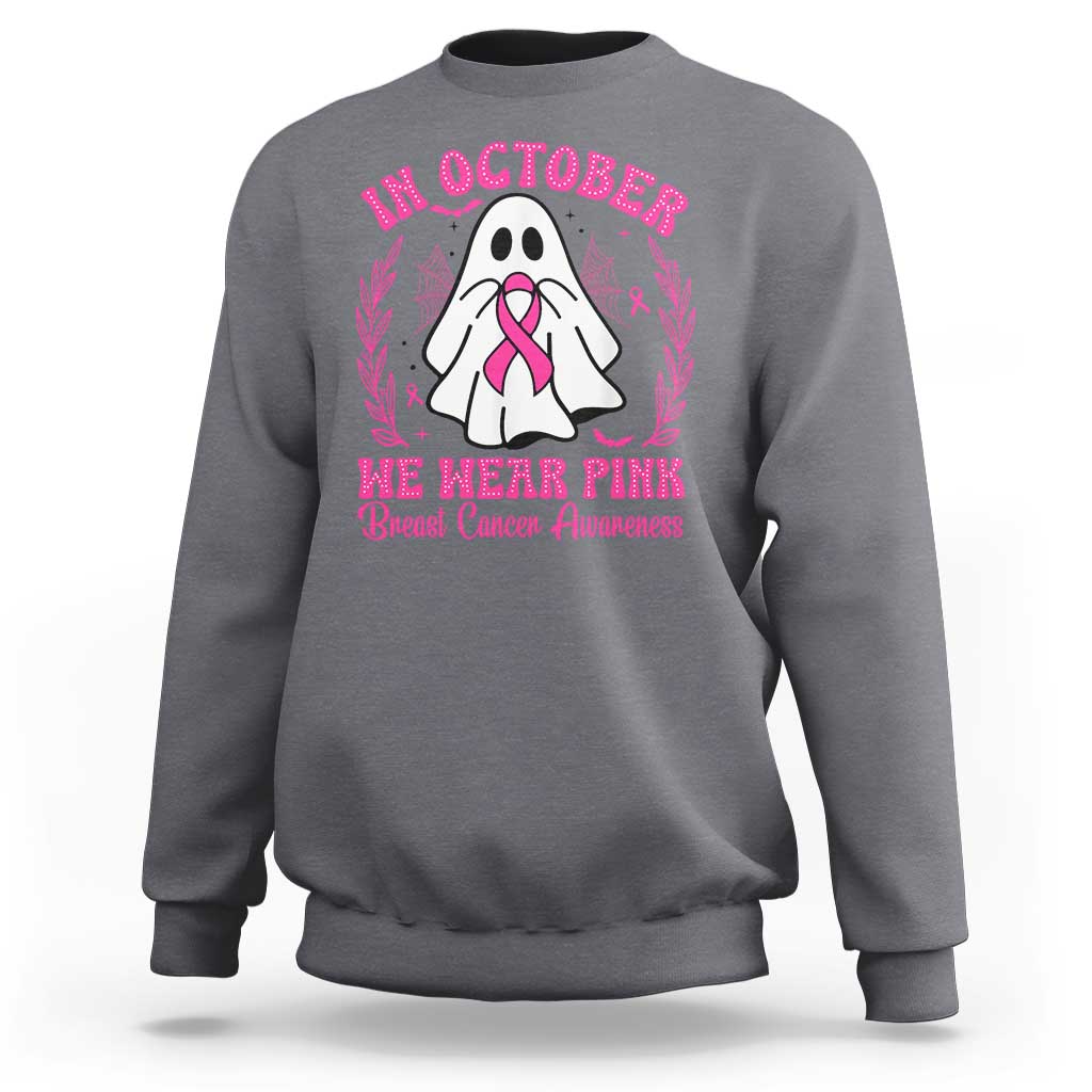 Charcoal crewneck sweatshirt with pink breast cancer awareness graphic on back.