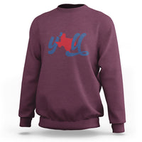 Maroon crewneck sweatshirt with red Texas graphic and blue cursive print