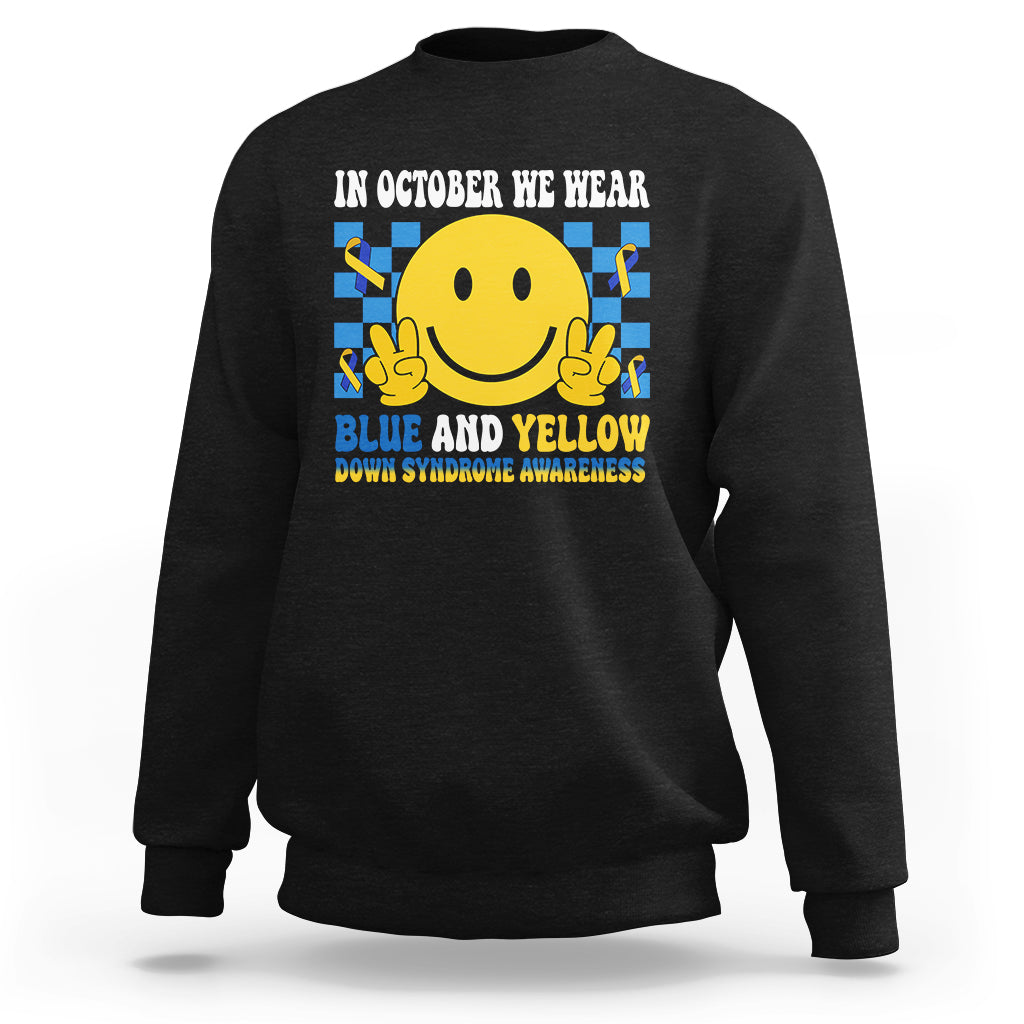 Black sweatshirt with yellow smiley graphic and blue-and-yellow awareness text on back.