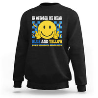 Black sweatshirt with yellow smiley graphic and blue-and-yellow awareness text on back.
