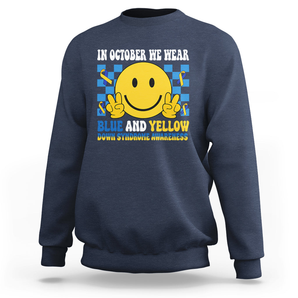 Navy sweatshirt with yellow smiley and blue-and-yellow awareness text on back.