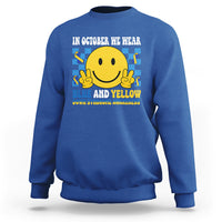 Royal blue sweatshirt with yellow smiley and blue-and-yellow awareness text on back.