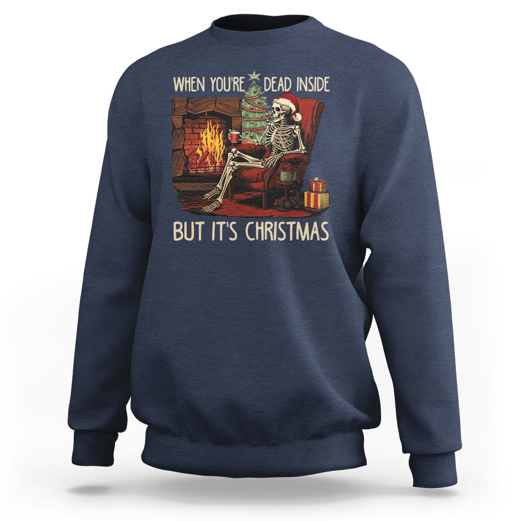 Navy crewneck sweatshirt with skeleton holiday graphic and 'BUT IT'S CHRISTMAS' text