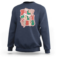 Navy crewneck sweatshirt with colorful 'joy' holiday graphic on front.