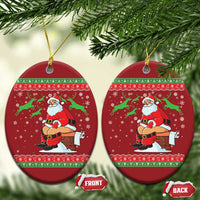 Set of red oval Christmas ornaments with Santa chimney scene and gold hanging strings